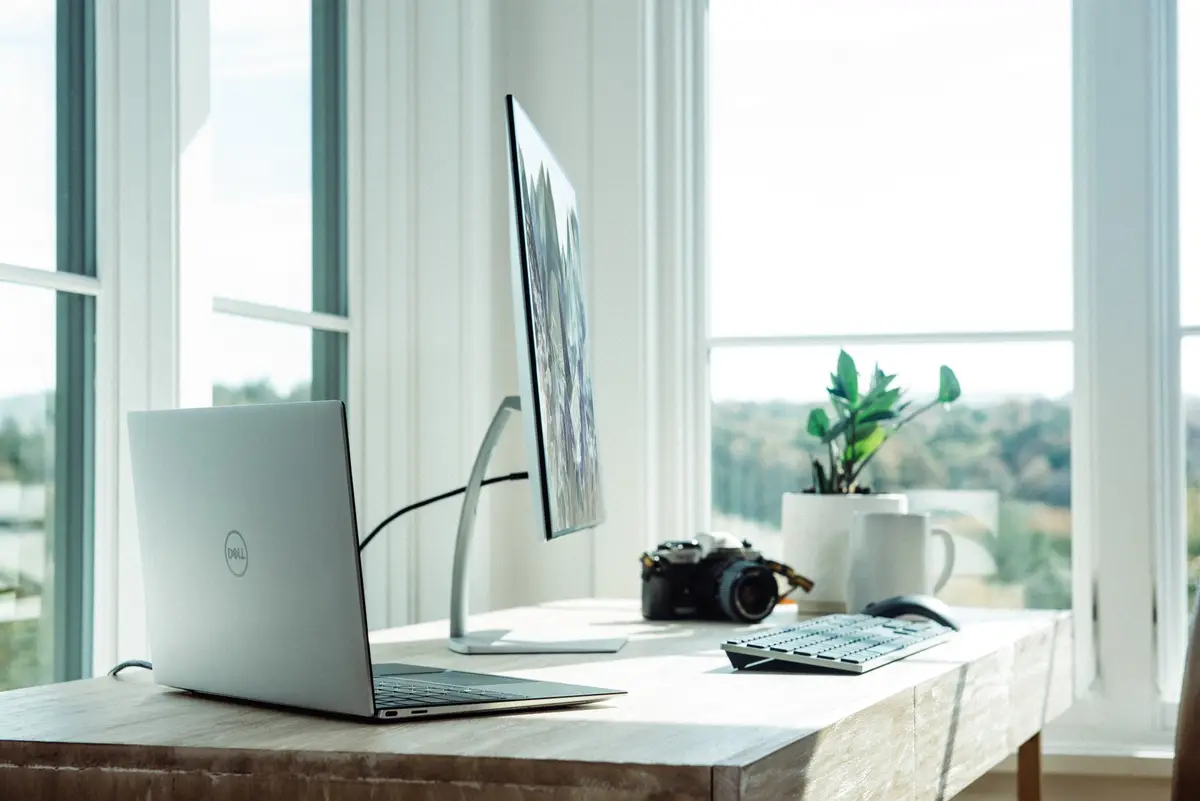 Laptop and monitor set up on a home office desk